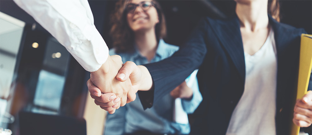 Close up of business partners shaking hands