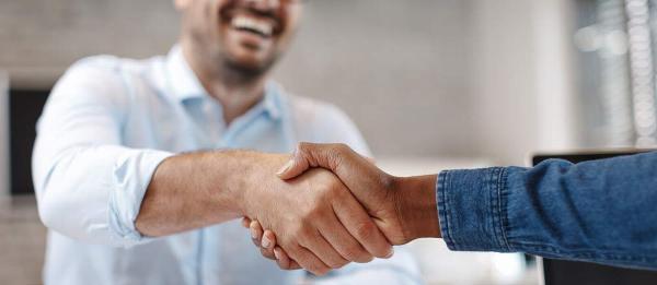 Close up of business partners shaking hands